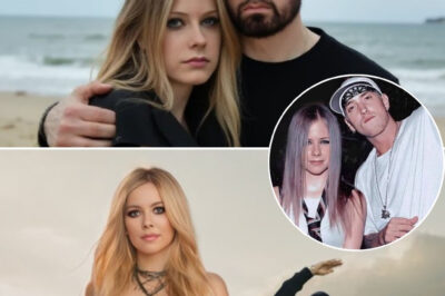 Call it punk meets pain. Rage meets romance. In one of the most unexpected collaborations of the year, rap titan Eminem and pop-punk icon Avril Lavigne have joined forces for a brooding, emotional track titled “I’ll Follow You.” The song blends Avril’s raw, grunge-tinged vocals with Eminem’s trademark lyrical fire — telling the story of two broken souls who can’t let each other go, no matter how far they fall. “If I’m going to hell,” Em spits in one verse, “I’ll follow you just to burn beside you.” And just like that, the internet went nuclear.
