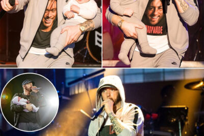 Eminem Shocks Fans by Holding His 3-Month-Old Grandson on Stage Rehearsal — Will We Really See His Grandson on the Upcoming Tour?! We might actually see Eminem’s grandson on the upcoming tour — a revelation that sent chills through the entire crew! It wasn’t a studio session, but the biggest rehearsal of the year. Eminem appeared on stage holding his 3-month-old grandson and performed a completely new rap song. At the chorus, he handed the mic to the baby — whose innocent babbling perfectly matched the beat, bringing everyone to tears. At the end, Eminem whispered something deeply personal and haunting to the fans about what’s coming — leaving the whole team frozen and himself in tears. Is this a farewell? Or a major turning point in his life? WATCH BELOW GET READY TO BE SHOCKED ABOUT HIS UPCOMING TOUR!