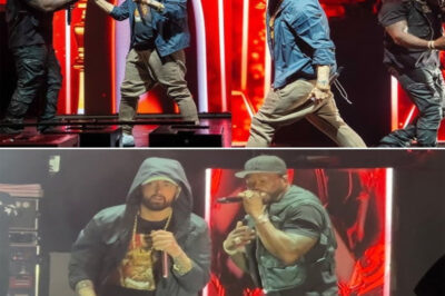 Eminem Sent The Crowd Into A Frenzy Of Joy As He Became The “Surprise Gift” 50 Cent Had Been Secretly Saving For Fans At The Pine Knob Music Theatre! While 50 Cent Was Trying To Keep Things Under Wraps And Performing “Crack A Bottle,” Eminem Suddenly Appeared On Stage! The Two Longtime Friends Embraced Before Setting The Stage On Fire With A Jaw-Dropping Duet That Blew The Roof Off! Nearly 20,000 Fans In Attendance Agreed—This Was One Of The Most Iconic Performances They Had Ever Witnessed In The World Of Rap! Watch Full Video Below!