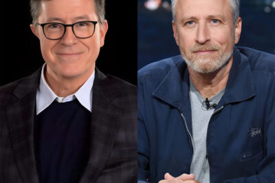 “Nice Try, Apple — You Just Pissed Off Jon Stewart and Stephen Colbert, and Now the Whole Industry’s Panicking” It was supposed to be a quiet kill — cancel the show, bury the headlines, move on. But someone forgot one very inconvenient truth: you don’t muzzle Jon Stewart without consequences, and you definitely don’t do it when Stephen Colbert is just a phone call away. After Apple TV+ pulled the plug on The Problem with Jon Stewart, reportedly over his refusal to “play nice” on topics like China, Big Tech, and the military-industrial complex, what should’ve been a routine decision has detonated into a full-blown media meltdown. Just days after the cancellation, Stewart and Colbert were spotted slipping into a closed-door meeting that sources now describe as “the calm before the storm.” Industry execs are sweating bullets as rumors swirl of a rogue media movement — one that could tear down the sanitized, corporate walls of television and rebuild it on their own terms. Every network is asking the same question: what are they planning? And the fact that no one knows is exactly what has Hollywood terrified. What started as one show’s quiet death may have just triggered the loudest revolution TV has seen in decades.