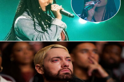 A 20-year-old Black woman walked onto The Voice stage with nothing but a mic in her hand and fire in her heart. No backup, no flash—just guts. Then she did the unthinkable: she chose Eminem’s “Lose Yourself.” The crowd held its breath. One verse in, the room went silent—not out of shock, but awe. She didn’t just sing it—she owned it. Every word hit different. She turned that hard-edged anthem into something soulful, raw, and heartbreakingly beautiful. You could feel her story in every note. By the time she hit the last line, the judges were on their feet. The audience? Stunned, standing, some even crying. But the most powerful moment came quietly—when the camera cut to Eminem, standing backstage, a tear sliding down his cheek. In that moment, it was clear: she didn’t just perform a song—she climbed, note by note, onto a stairway to something bigger. Maybe even heaven