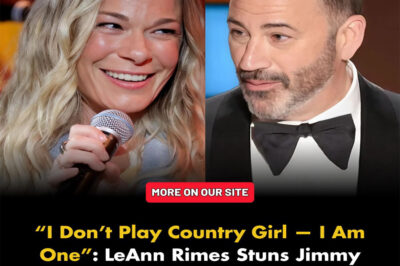 It started with laughs — and ended with LeAnn Rimes owning the night. During what was supposed to be a playful interview, Jimmy Kimmel smirked and asked: “LeAnn, how’s it feel to still play the country girl after all these years?” The room chuckled. LeAnn Rimes smiled — but not with her eyes. She leaned in, voice low but unshakable: “Jimmy, I don’t play country girl. I am one. Some of us don’t need to act — we live it.” The room went still. Kimmel laughed nervously. “Hey, it’s all just entertainment, right?” LeAnn didn’t flinch. Her voice softened — but the steel remained. “Entertainment happens when the lights go out. What I do? That’s heart. That’s truth. That’s faith. And you can’t fake that.” Applause broke out like thunder. Kimmel tried to pivot, but she was already standing. “You make people laugh for a moment. I make them feel something that stays. That’s the difference.” And with that, she nodded gracefully — and walked off. The audience stood. Kimmel was left speechless. And the country remembered what real sounds like.