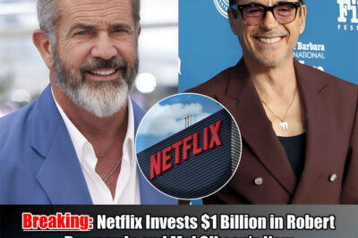 “Netflix just went ‘nuclear’ on the traditional studio system. In a $1 billion gambit that has paralyzed the 2026 award season, the streaming giant is reportedly bankrolling a new creative fortress led by Robert Downey Jr. and Mel Gibson. This isn’t just a production deal; it’s an ‘unfiltered’ alliance designed to bypass Hollywood’s ideological gatekeepers. With a ten-figure check on the table and zero creative restrictions, find out which ‘forbidden’ scripts the duo is greenlighting first. The era of the ‘Un-Woke’ blockbuster has officially arrived.”