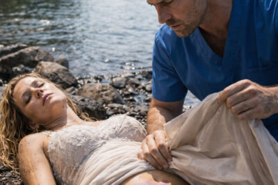 After I jumped into the river in my wedding dress, a surgeon pulled me from the water and fought to save my life. But when he lifted the soaked fabric to check if I was still breathing, he was stunned to discover the secret hidden beneath.