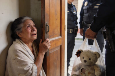 The police banged on the door as if they were there to arrest someone.