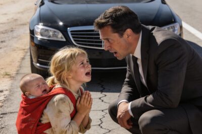 The millionaire slammed on his brakes when he noticed a girl with a red backpack walking along the side of the road. What he found inside that backpack left him completely speechless.